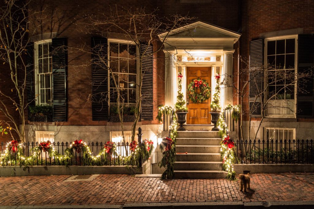 Holiday lighting on a home at night